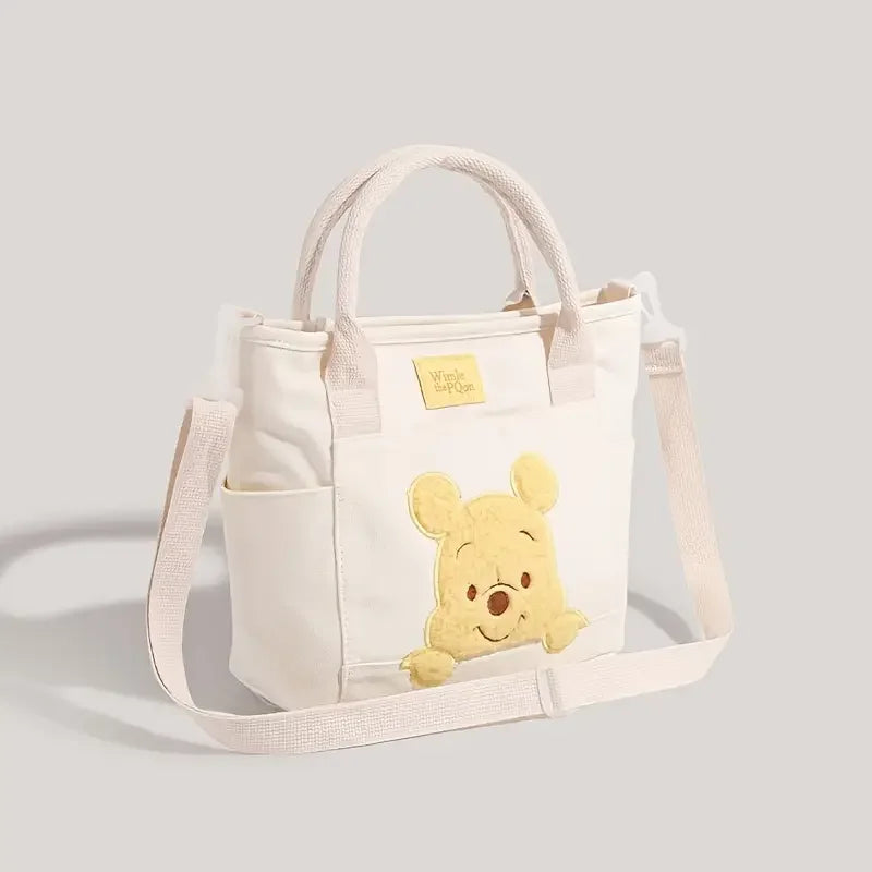 The Mesuca Cute Cartoon Bear Canvas Tote Bag Women Casual Handbag Detachable Shoulder Strap Crossbody Purse, Large Capacity Multi‑Pocket Daily Travel Shopping Shoulder Bag